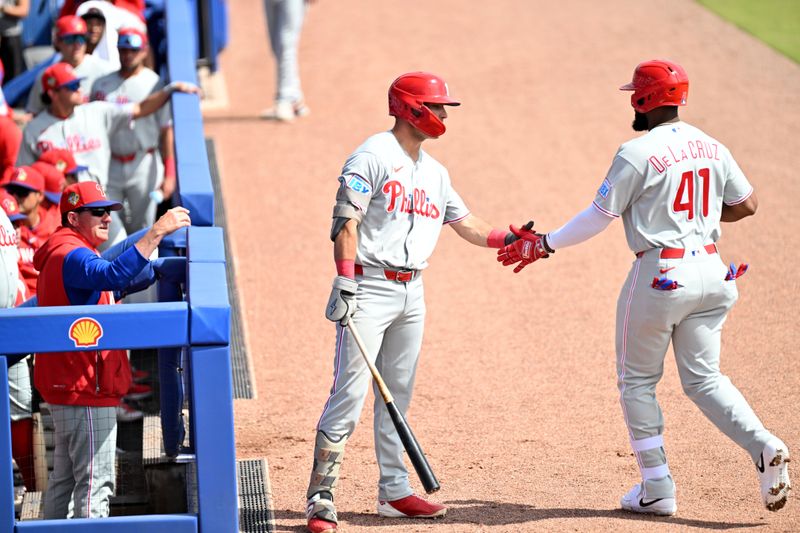 Feb 28, 2026; Dunedin, Florida, USA;  Philadelphia Phillies right fielder Bryan De La Cruz (41) celebrates with Philadelphia Phillies third baseman Carson DeMartini (78) after hitting a solo home run in the second  inning against the Toronto Blue Jays during spring training  at TD Ballpark. Mandatory Credit: Jonathan Dyer-Imagn Images