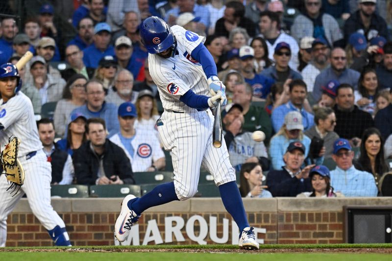 May 6, 2025; Chicago, Illinois, USA;  Chicago Cubs shortstop Dansby Swanson (7) singles during the third inning against the San Francisco Giants at Wrigley Field. Mandatory Credit: Matt Marton-Imagn Images