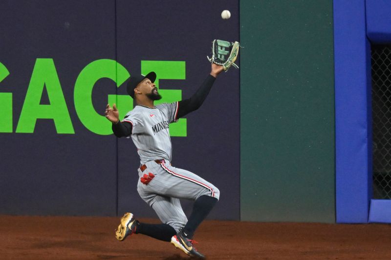 Apr 29, 2025; Cleveland, Ohio, USA; Minnesota Twins center fielder Byron Buxton (25) makes a sliding catch in the third inning against the Cleveland Guardians at Progressive Field. Mandatory Credit: David Richard-Imagn Images