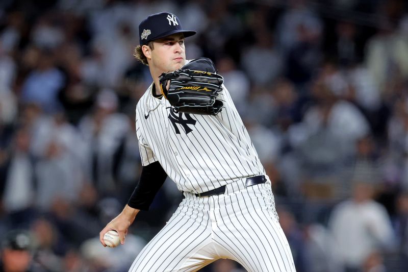 Oct 8, 2025; Bronx, New York, USA; New York Yankees pitcher Cam Schlittler (31) pitches during the first inning against the Toronto Blue Jays during game four of the ALDS round for the 2025 MLB playoffs at Yankee Stadium. Mandatory Credit: Brad Penner-Imagn Images
