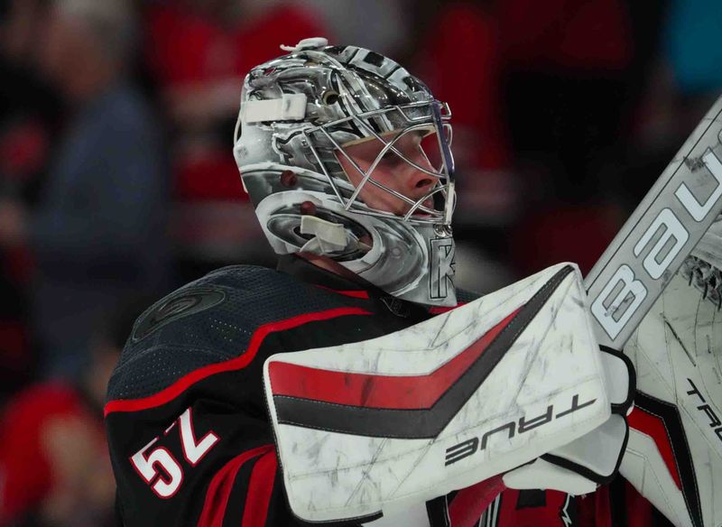 Nov 22, 2023; Raleigh, North Carolina, USA; Carolina Hurricanes goaltender Pyotr Kochetkov (52) looks on against the Edmonton Oilers during the second period at PNC Arena. Mandatory Credit: James Guillory-USA TODAY Sports