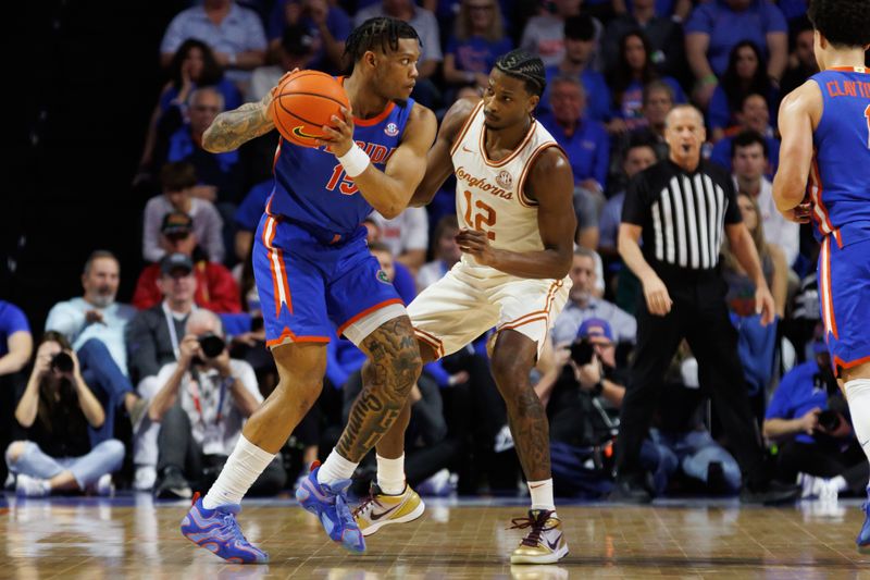 Jan 18, 2025; Gainesville, Florida, USA; Florida Gators guard Alijah Martin (15) looks to pass away from Texas Longhorns guard Tramon Mark (12) during the first half at Exactech Arena at the Stephen C. O'Connell Center. Mandatory Credit: Matt Pendleton-Imagn Images