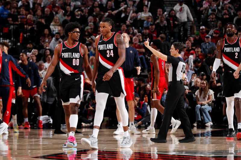 PORTLAND, OR - APRIL 9: Scoot Henderson #00 of the Portland Trail Blazers and Jabari Walker #34 of the Portland Trail Blazers look on during the game against the New Orleans Pelicans on April 9, 2024 at the Moda Center Arena in Portland, Oregon. NOTE TO USER: User expressly acknowledges and agrees that, by downloading and or using this photograph, user is consenting to the terms and conditions of the Getty Images License Agreement. Mandatory Copyright Notice: Copyright 2024 NBAE (Photo by Cameron Browne/NBAE via Getty Images)