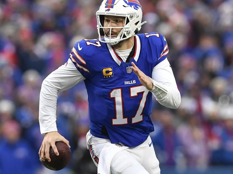 Buffalo Bills quarterback Josh Allen (17) runs with the ball during the first half of an NFL football game against the New England Patriots in Orchard Park, N.Y., Sunday, Dec. 31, 2023. (AP Photo/Adrian Kraus)