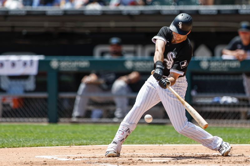 Jun 10, 2023; Chicago, Illinois, USA; Chicago White Sox left fielder Andrew Benintendi (23) singles against the Miami Marlins during the first inning at Guaranteed Rate Field. Mandatory Credit: Kamil Krzaczynski-USA TODAY Sports