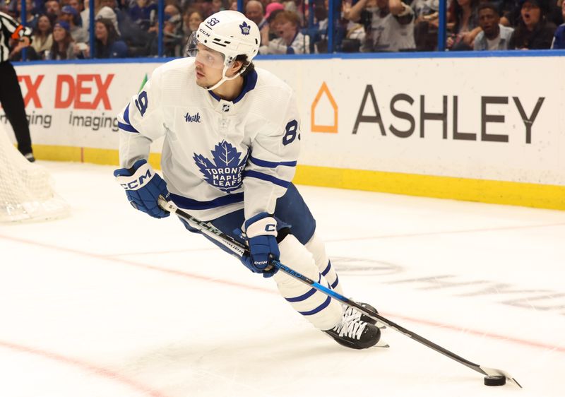 Apr 17, 2024; Tampa, Florida, USA; Toronto Maple Leafs left wing Nicholas Robertson (89) skates with the puck against the Tampa Bay Lightning during the first period at Amalie Arena. Mandatory Credit: Kim Klement Neitzel-USA TODAY Sports