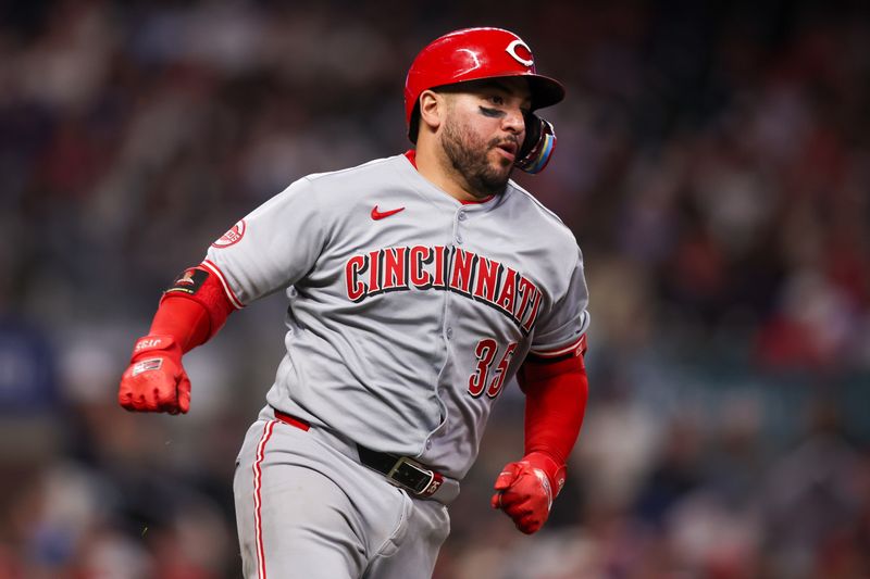 May 8, 2025; Atlanta, Georgia, USA; Cincinnati Reds catcher Jose Trevino (35) hits a double against the Atlanta Braves in the seventh inning at Truist Park. Mandatory Credit: Brett Davis-Imagn Images