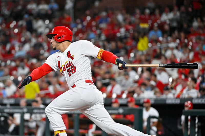 Aug 15, 2023; St. Louis, Missouri, USA;  St. Louis Cardinals third baseman Nolan Arenado (28) hits a single against the Oakland Athletics during the fifth inning at Busch Stadium. Mandatory Credit: Jeff Curry-USA TODAY Sports