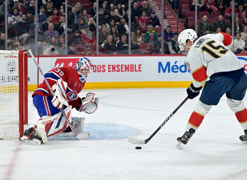 Apr 2, 2024; Montreal, Quebec, CAN; Florida Panthers forward Anton Lundell (15) scores a goal against Montreal Canadiens goalie Sam Montembeault (35) during the first period at the Bell Centre. Mandatory Credit: Eric Bolte-USA TODAY Sports