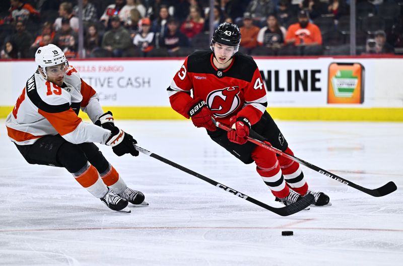 Apr 13, 2024; Philadelphia, Pennsylvania, USA; Philadelphia Flyers right wing Garnet Hathaway (19) reaches across New Jersey Devils defenseman Luke Hughes (43) in the third period at Wells Fargo Center. Mandatory Credit: Kyle Ross-USA TODAY Sports