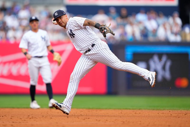 Jul 8, 2023; Bronx, New York, USA; New York Yankees second baseman Gleybor Torres (25) throws out Chicago Cubs shortstop Nico Hoerner (not pictured) during the third inning at Yankee Stadium. Mandatory Credit: Gregory Fisher-USA TODAY Sports