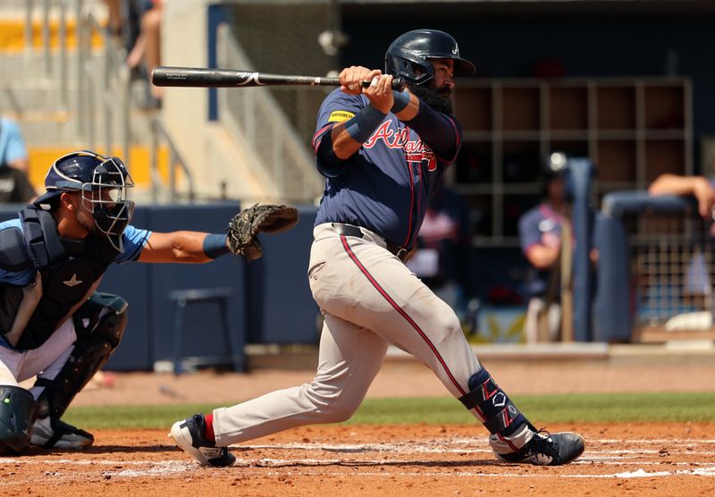 Mar 18, 2024; Port Charlotte, Florida, USA;  Atlanta Braves second baseman Luis Guillorme (15) singles during the third inning against the Tampa Bay Rays at Charlotte Sports Park. Mandatory Credit: Kim Klement Neitzel-USA TODAY Sports