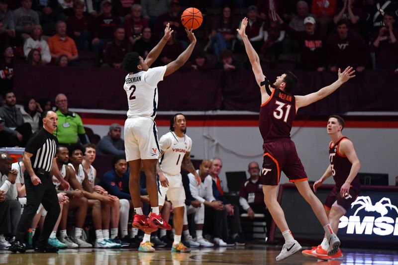 Feb 19, 2024; Blacksburg, Virginia, USA; Virginia Cavaliers guard Reece Beekman (2) shoots a three point basket over Virginia Tech Hokies forward Robbie Beran (31) during the second half at Cassell Coliseum. Mandatory Credit: Brian Bishop-USA TODAY Sports