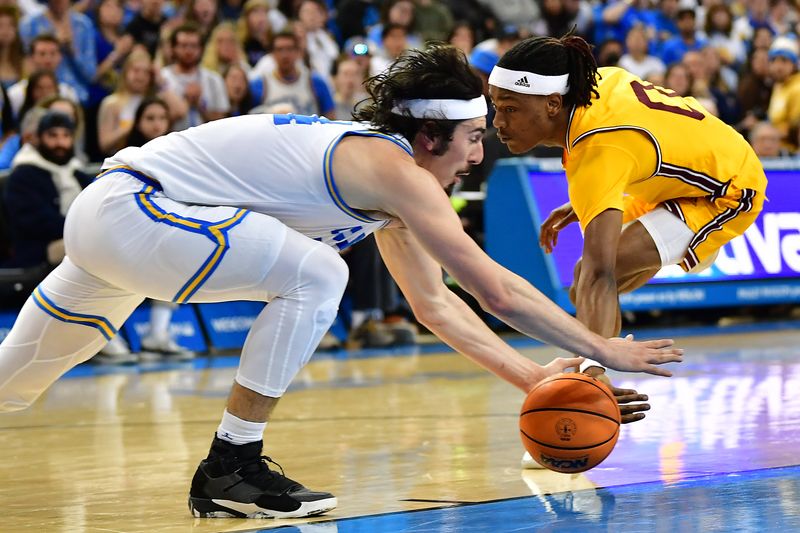 Mar 2, 2023; Los Angeles, California, USA; UCLA Bruins guard Jaime Jaquez Jr. (24) plays for the ball against Arizona State Sun Devils guard DJ Horne (0) during the first half at Pauley Pavilion. Mandatory Credit: Gary A. Vasquez-USA TODAY Sports