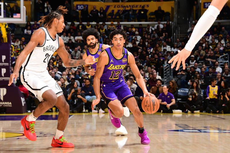 LOS ANGELES, CA - JANUARY 17: Max Christie #12 of the Los Angeles Lakers dribbles the ball during the game against the Brooklyn Nets on January 17, 2025 at Crypto.Com Arena in Los Angeles, California. NOTE TO USER: User expressly acknowledges and agrees that, by downloading and/or using this Photograph, user is consenting to the terms and conditions of the Getty Images License Agreement. Mandatory Copyright Notice: Copyright 2025 NBAE (Photo by Adam Pantozzi/NBAE via Getty Images)