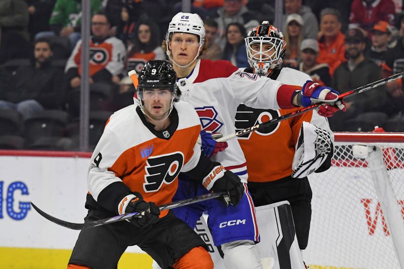 Oct 27, 2024; Philadelphia, Pennsylvania, USA; Montreal Canadiens center Christian Dvorak (28) batted with Philadelphia Flyers defenseman Jamie Drysdale (9) form position in front of goaltender Aleksei Kosolov (35) during the first period at Wells Fargo Center. Mandatory Credit: Eric Hartline-Imagn Images