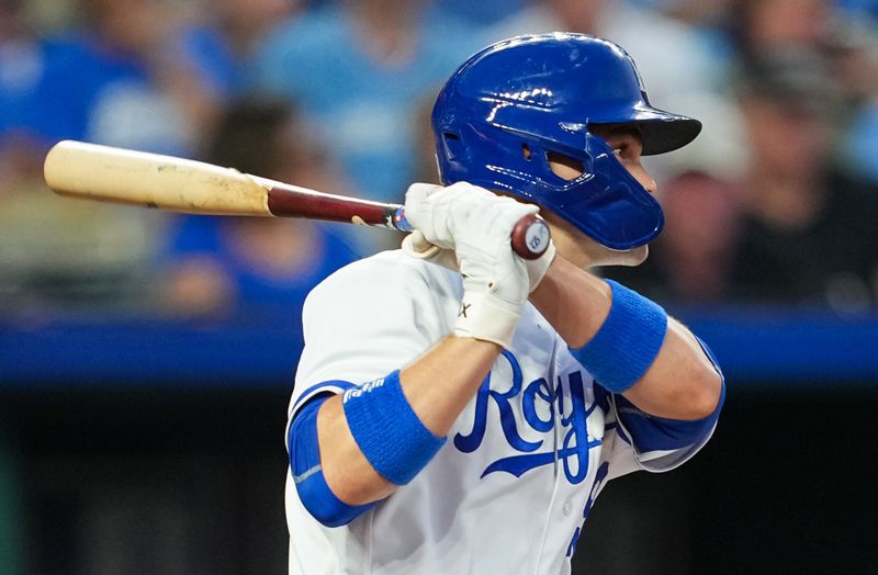 Aug 15, 2023; Kansas City, Missouri, USA; Kansas City Royals second baseman Michael Massey (19) hits a single during the fourth inning against the Seattle Mariners at Kauffman Stadium. Mandatory Credit: Jay Biggerstaff-USA TODAY Sports