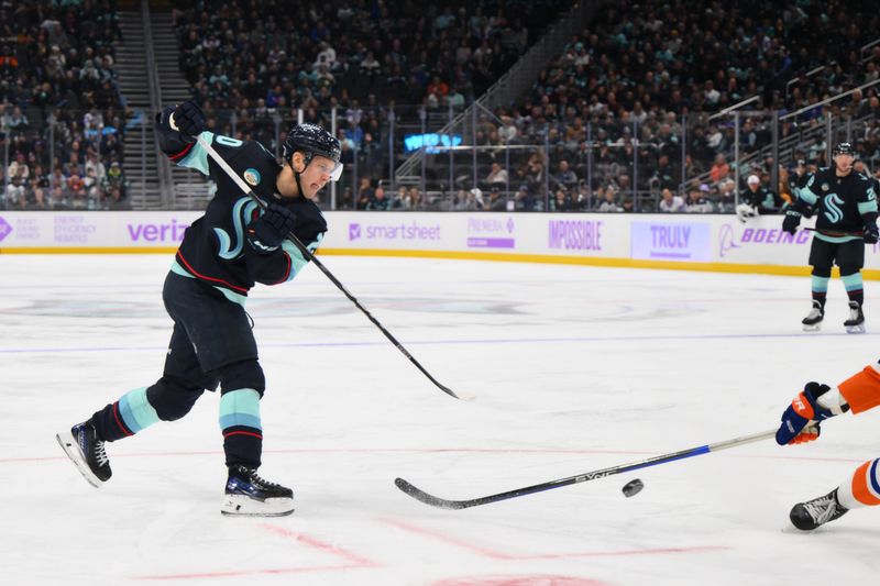 Nov 16, 2023; Seattle, Washington, USA; Seattle Kraken right wing Eeli Tolvanen (20) shoots a goal shot against the New York Islanders during the third period at Climate Pledge Arena. Mandatory Credit: Steven Bisig-USA TODAY Sports