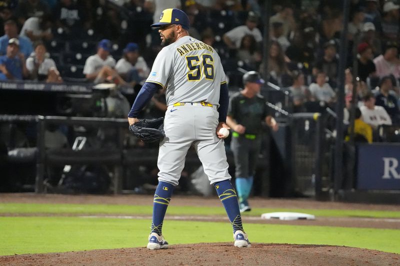May 9, 2025; Tampa, Florida, USA; Milwaukee Brewers relief pitcher Grant Anderson (56) checks the runner at first as he pitches agains the Tampa Bay Rays during the seventh inning at George M. Steinbrenner Field. Mandatory Credit: Dave Nelson-Imagn Images