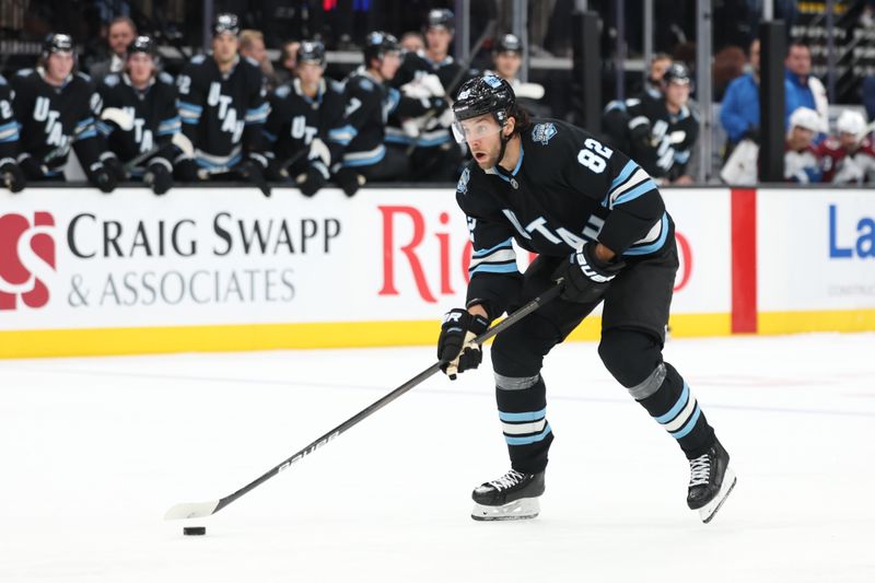 Oct 24, 2024; Salt Lake City, Utah, USA; Utah Hockey Club center Kevin Stenlund (82) skates with the puck against against the Colorado Avalanche during the second period at Delta Center. Mandatory Credit: Rob Gray-Imagn Images