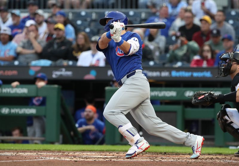 Apr 29, 2025; Pittsburgh, Pennsylvania, USA;  Chicago Cubs designated hitter Seiya Suzuki (27) hits a double against the Pittsburgh Pirates during the fourth inning at PNC Park. Mandatory Credit: Charles LeClaire-Imagn Images