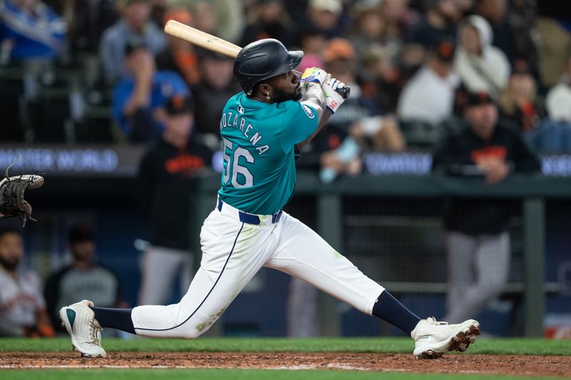 Aug 23, 2024; Seattle, Washington, USA; Seattle Mariners left fielder Randy Arozarena (56) hits a double during the fifth inning against the San Francisco Giants at T-Mobile Park. Mandatory Credit: Stephen Brashear-USA TODAY Sports