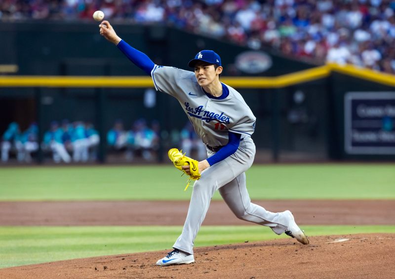 May 9, 2025; Phoenix, Arizona, USA; Los Angeles Dodgers pitcher Roki Sasaki against the Arizona Diamondbacks in the first inning at Chase Field. Mandatory Credit: Mark J. Rebilas-Imagn Images