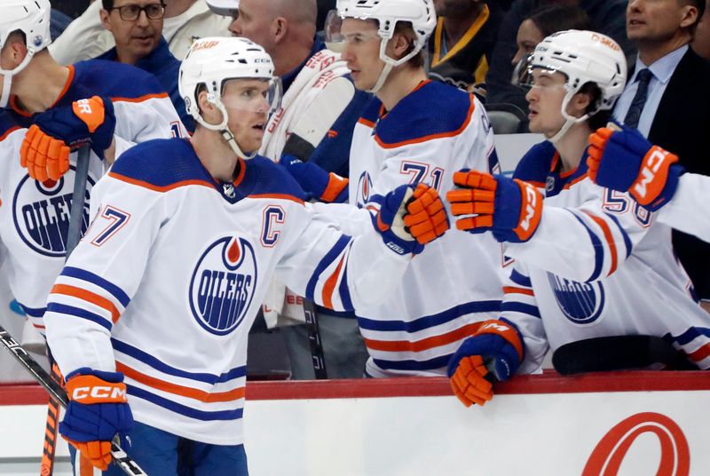 Feb 23, 2023; Pittsburgh, Pennsylvania, USA;  Edmonton Oilers center Connor McDavid (97) celebrates with the Oilers bench after scoring a goal against the Pittsburgh Penguins during the first period at PPG Paints Arena. Mandatory Credit: Charles LeClaire-USA TODAY Sports