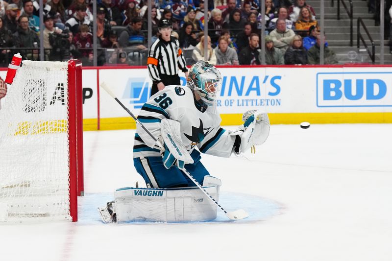 Dec 31, 2023; Denver, Colorado, USA; San Jose Sharks goaltender Kaapo Kahkonen (36) prepares to make a save in the second period against the Colorado Avalanche at Ball Arena. Mandatory Credit: Ron Chenoy-USA TODAY Sports