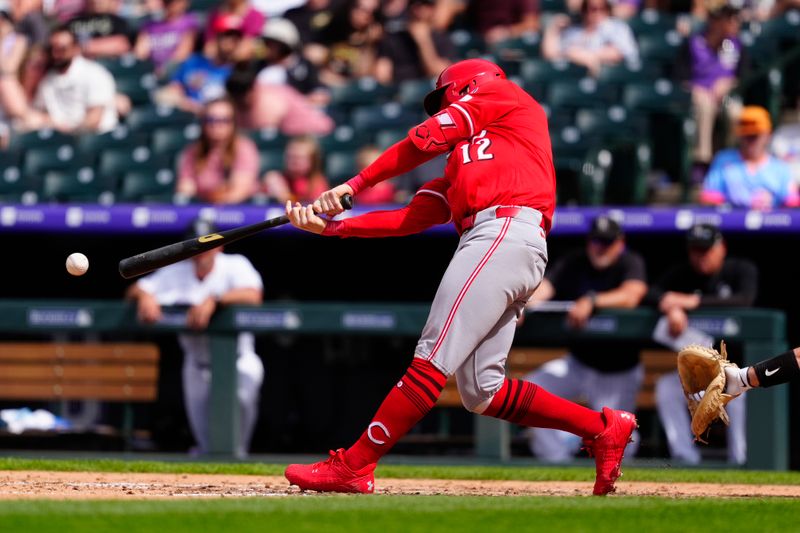 Apr 27, 2025; Denver, Colorado, USA; Cincinnati Reds outfielder Austin Hays (12) doubles in the ninth inning against the Colorado Rockies at Coors Field. Mandatory Credit: Ron Chenoy-Imagn Images