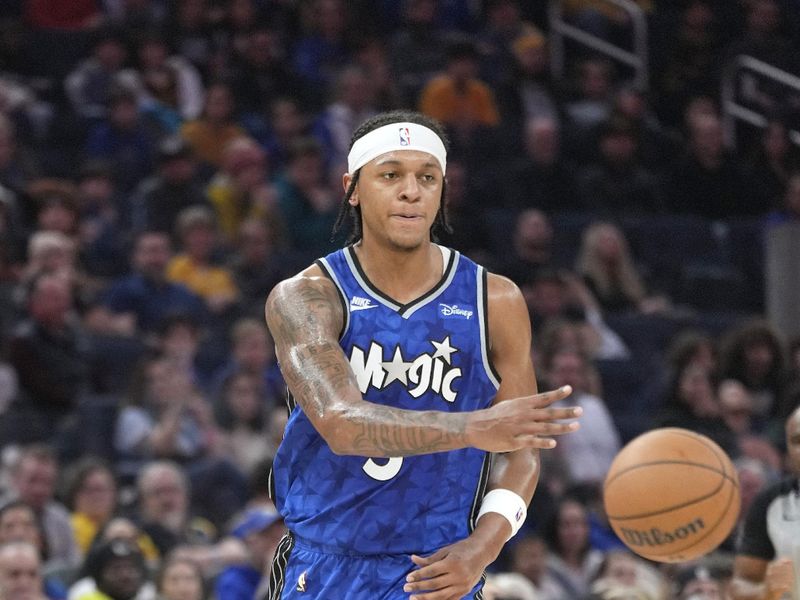 SAN FRANCISCO, CALIFORNIA - JANUARY 02: Paolo Banchero #5 of the Orlando Magic looks to pass the ball against the Golden State Warriors during the first quarter of an NBA basketball game at Chase Center on January 02, 2024 in San Francisco, California. NOTE TO USER: User expressly acknowledges and agrees that, by downloading and or using this photograph, User is consenting to the terms and conditions of the Getty Images License Agreement. (Photo by Thearon W. Henderson/Getty Images)