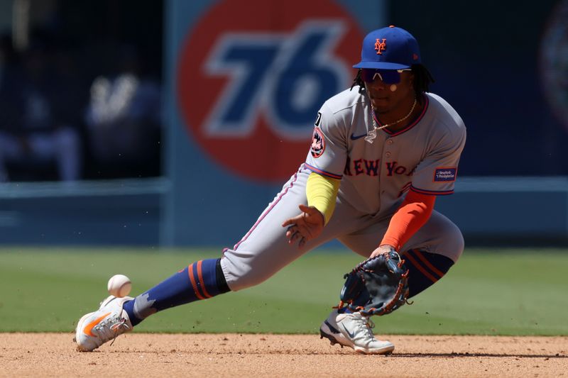 Jun 5, 2025; Los Angeles, California, USA; New York Mets second baseman Luisangel Acuna (2) fields a ground ball during the sixth inning against the Los Angeles Dodgers at Dodger Stadium. Mandatory Credit: Jason Parkhurst-Imagn Images