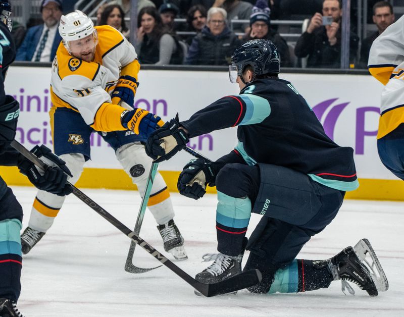 Nov 20, 2024; Seattle, Washington, USA;  Nashville Predators forward Steven Stamkos (91) has a shot blocked by Seattle Kraken defenseman Will Borgen (3) during the first period at Climate Pledge Arena. Mandatory Credit: Stephen Brashear-Imagn Images