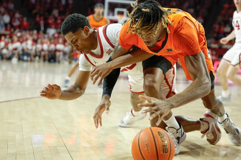 Feb 1, 2023; Norman, Oklahoma, USA; Oklahoma State Cowboys forward Tyreek Smith (23) and Oklahoma Sooners guard Grant Sherfield (25) fight for a loose ball during the first half at Lloyd Noble Center. Mandatory Credit: Alonzo Adams-USA TODAY Sports