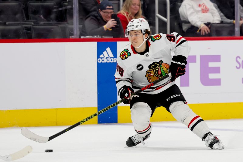 Nov 30, 2023; Detroit, Michigan, USA; Chicago Blackhawks center Connor Bedard (98) skates with the puck in the third period against the Detroit Red Wings at Little Caesars Arena. Mandatory Credit: Rick Osentoski-USA TODAY Sports