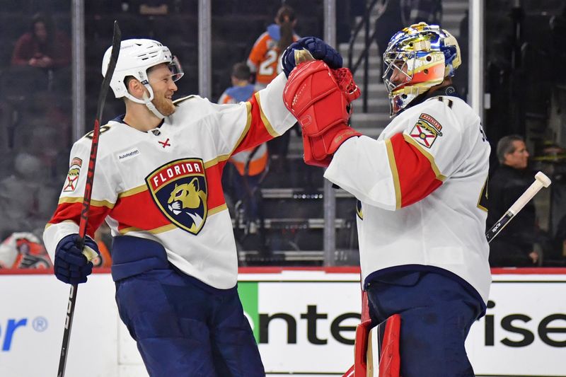 Mar 24, 2024; Philadelphia, Pennsylvania, USA; Florida Panthers center Steven Lorentz (18) and goaltender Anthony Stolarz (41) celebrate win against the Philadelphia Flyers during the third period at Wells Fargo Center. Mandatory Credit: Eric Hartline-USA TODAY Sports