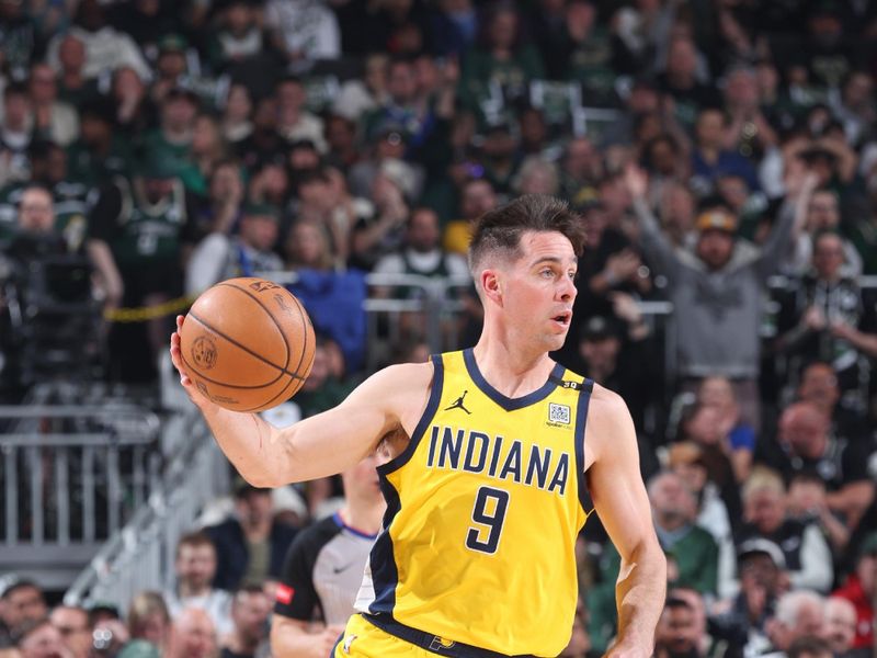 MILWAUKEE, WI - APRIL 21:  T.J. McConnell #9 of the Indiana Pacers handles the ball during the game  against the Milwaukee Bucks during Round 1 Game 1 of the 2024 NBA Playoffs  on April 21, 2024 at the Fiserv Forum Center in Milwaukee, Wisconsin. NOTE TO USER: User expressly acknowledges and agrees that, by downloading and or using this Photograph, user is consenting to the terms and conditions of the Getty Images License Agreement. Mandatory Copyright Notice: Copyright 2024 NBAE (Photo by Jeff Haynes/NBAE via Getty Images).