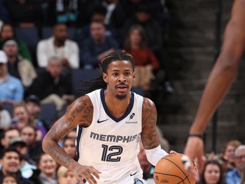 MEMPHIS, TN - DECEMBER 5: Ja Morant #12 of the Memphis Grizzlies dribbles the ball during the game against the Sacramento Kings on December 5, 2024 at FedExForum in Memphis, Tennessee. NOTE TO USER: User expressly acknowledges and agrees that, by downloading and or using this photograph, User is consenting to the terms and conditions of the Getty Images License Agreement. Mandatory Copyright Notice: Copyright 2024 NBAE (Photo by Joe Murphy/NBAE via Getty Images)