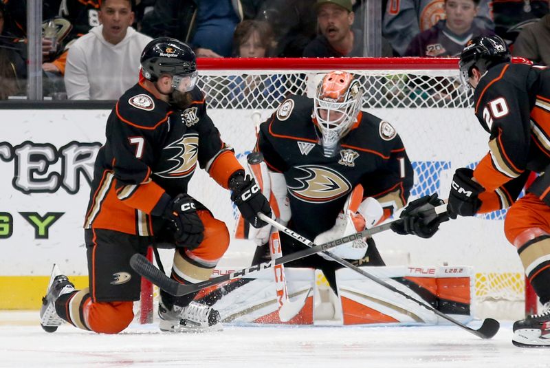 Mar 3, 2024; Anaheim, California, USA; Anaheim Ducks defenseman Radko Gudas (7) and goaltender Lukas Dostal (1) block a shot during the second period against the Vancouver Canucks at Honda Center. Mandatory Credit: Jason Parkhurst-USA TODAY Sports