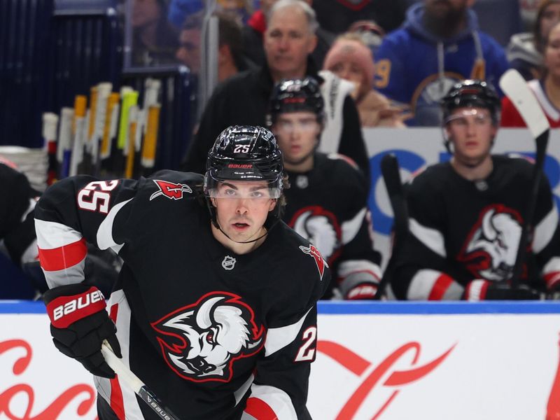 Jan 15, 2026; Buffalo, New York, USA;  Buffalo Sabres defenseman Owen Power (25) skates with the puck during the second period against the Montréal Canadiens at KeyBank Center. Mandatory Credit: Timothy T. Ludwig-Imagn Images