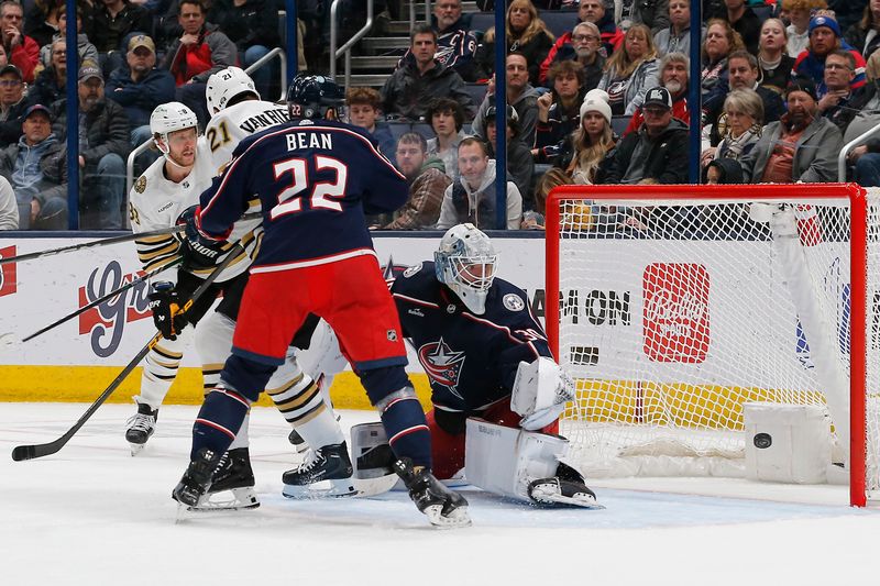 Jan 2, 2024; Columbus, Ohio, USA; Boston Bruins left wing James van Riemsdyk (21) tips the puck past Columbus Blue Jackets goalie Spencer Martin (30) for a goal during the second period at Nationwide Arena. Mandatory Credit: Russell LaBounty-USA TODAY Sports