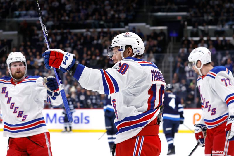 Oct 30, 2023; Winnipeg, Manitoba, CAN; New York Rangers left wing Artemi Panarin (10) celebrates his first period goal against the Winnipeg Jets at Canada Life Centre. Mandatory Credit: James Carey Lauder-USA TODAY Sports