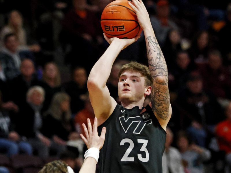 Jan 23, 2024; Blacksburg, Virginia, USA; Virginia Tech Hokies guard Tyler Nickel (23) shoots the ball against Boston College Eagles guard Mason Madsen (45) during the second half at Cassell Coliseum. Mandatory Credit: Peter Casey-USA TODAY Sports