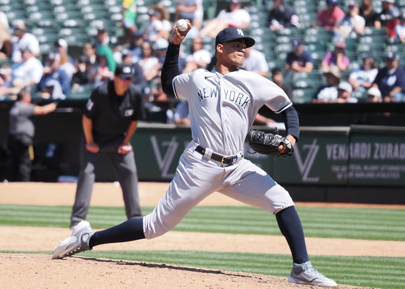 Jun 29, 2023; Oakland, California, USA; New York Yankees relief pitcher Albert Abreu (84) pitches the ball against the Oakland Athletics during the ninth inning at Oakland-Alameda County Coliseum. Mandatory Credit: Kelley L Cox-USA TODAY Sports