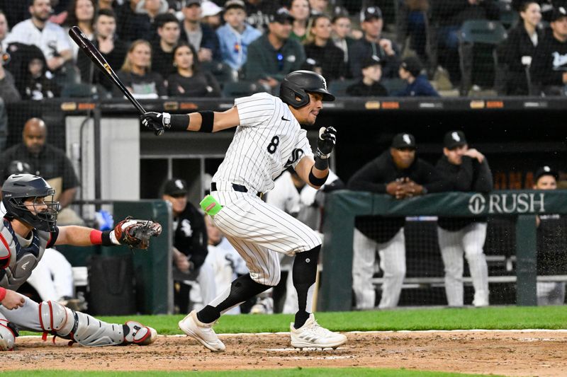 May 10, 2024; Chicago, Illinois, USA;  Chicago White Sox second base Nicky Lopez (8) hits in the fifth inning against the Cleveland Guardians at Guaranteed Rate Field. Mandatory Credit: Matt Marton-USA TODAY Sports