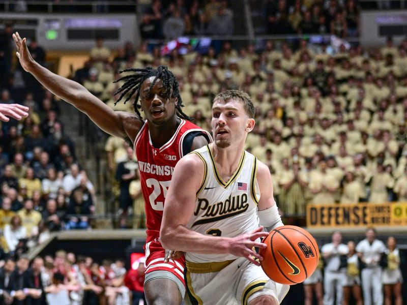 Mar 10, 2024; West Lafayette, Indiana, USA; Purdue Boilermakers guard Braden Smith (3) drives the ball around Wisconsin Badgers guard John Blackwell (25) during the second half at Mackey Arena. Mandatory Credit: Marc Lebryk-USA TODAY Sports