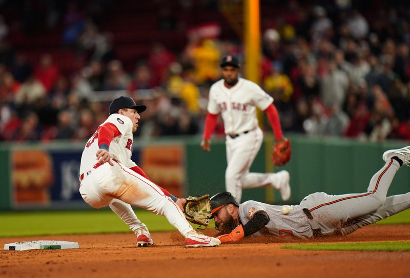 Apr 10, 2024; Boston, Massachusetts, USA; Baltimore Orioles outfielder Colton Cowser (17) safe at second base against Boston Red Sox shortstop Romy Gonzalez (23) in the third inning at Fenway Park. Mandatory Credit: David Butler II-USA TODAY Sports