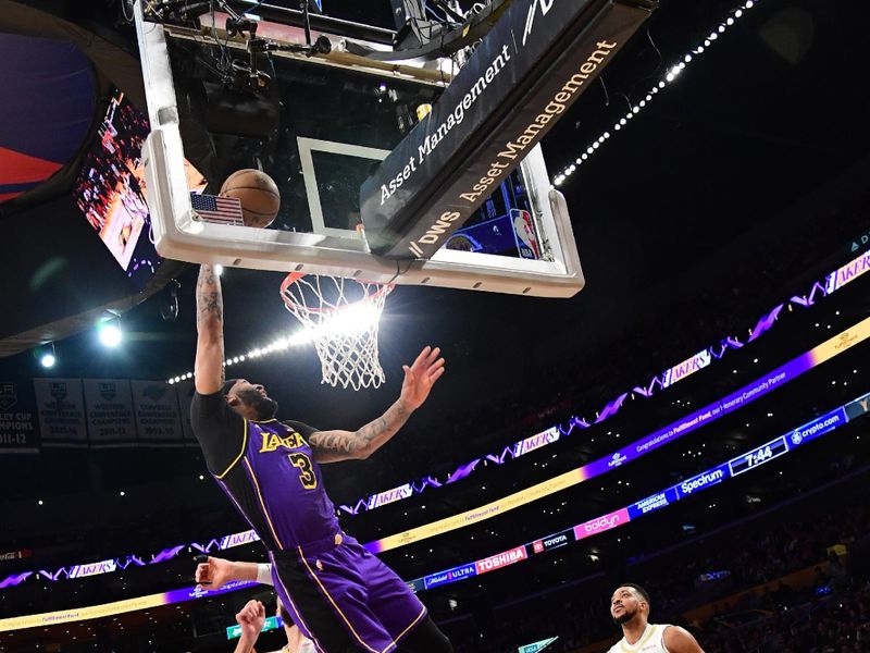 LOS ANGELES, CA - FEBRUARY 9:  Anthony Davis #3 of the Los Angeles Lakers drives to the basket during the game against the New Orleans Pelicans on February 9, 2024 at Crypto.Com Arena in Los Angeles, California. NOTE TO USER: User expressly acknowledges and agrees that, by downloading and/or using this Photograph, user is consenting to the terms and conditions of the Getty Images License Agreement. Mandatory Copyright Notice: Copyright 2024 NBAE (Photo by Adam Pantozzi/NBAE via Getty Images)