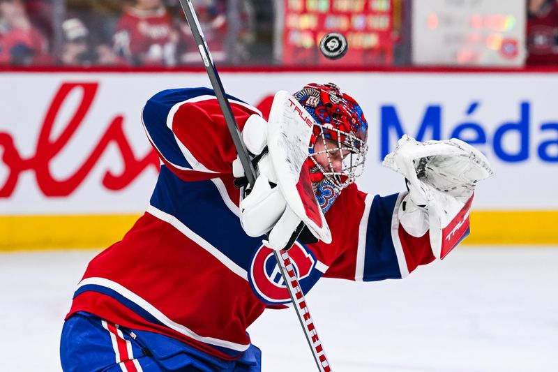 Feb 26, 2026; Montreal, Quebec, CAN; Montreal Canadiens goalie Samuel Montembeault (35) takes shots during warm-up before the game against the New York Islanders at Bell Centre. Mandatory Credit: David Kirouac-Imagn Images