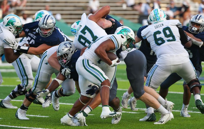 Oct 28, 2023; Houston, Texas, USA;Tulane Green Wave running back Makhi Hughes (21) rushes against the Rice Owls in the second half at Rice Stadium. Mandatory Credit: Thomas Shea-USA TODAY Sports